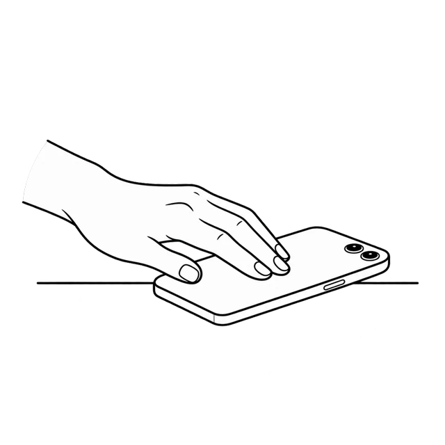 A hand setting a phone face down