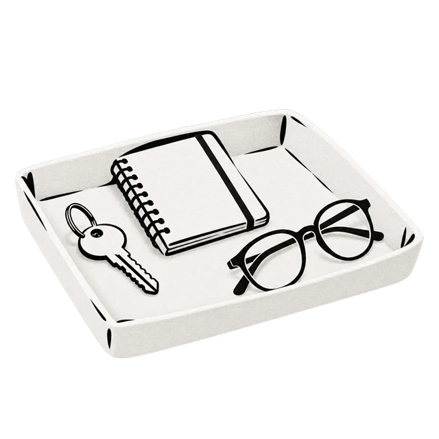 A tray keeping a notebook, key and glasses together